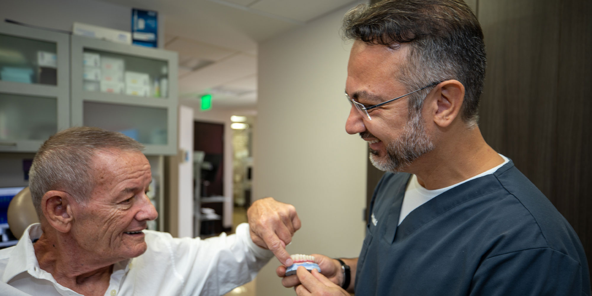 Dr. Burak Taskonak with implant patient